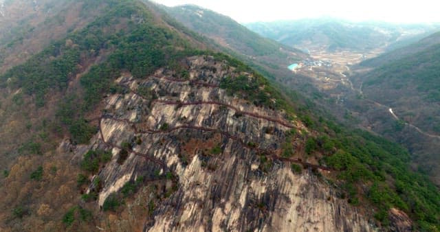 Winding Walking Path Surrounded by Steep Cliffs