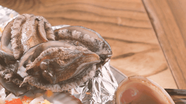 Fresh abalone on grill