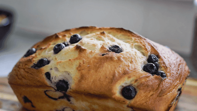 Freshly baked blueberry bread on a board
