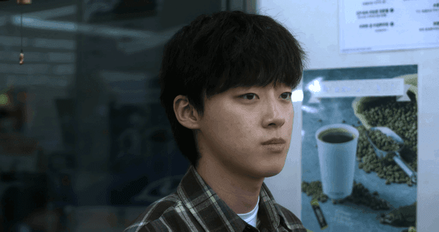 Young man looking straight at something