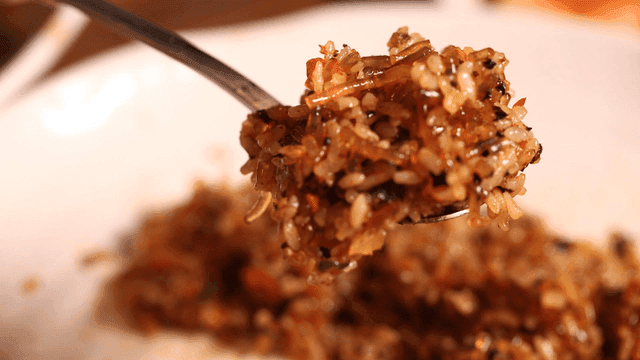 Spoonful of rice mixed with Jjimdak sauce