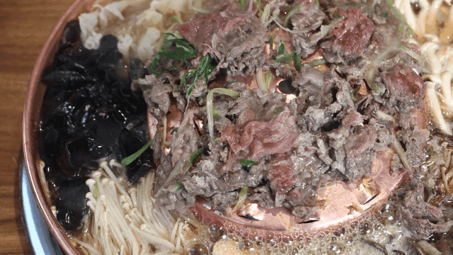 Beef bulgogi hot pot with mushrooms and vegetables