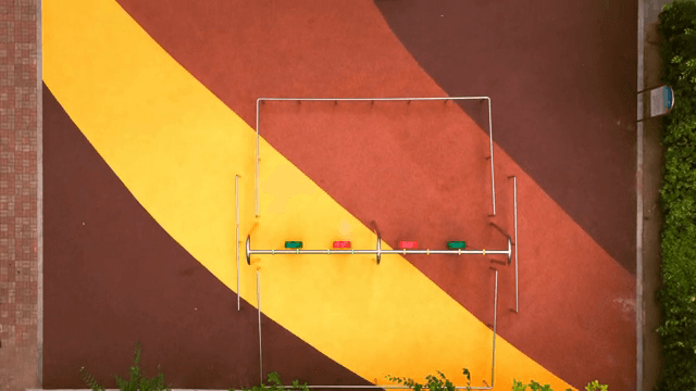 Colorful playground with swings and trees