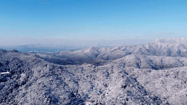 Snow-covered mountains under a clear blue sky