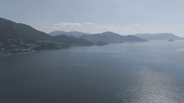 Vast sea with mountains visible in distance