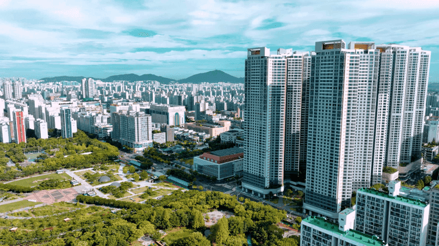 Vibrant cityscape with tall buildings and parks