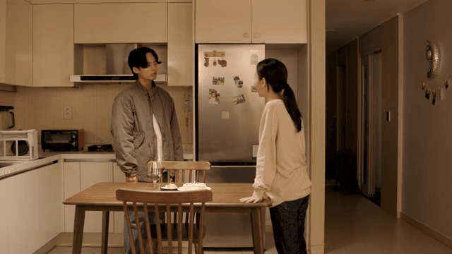 Couple in the kitchen having a conversation