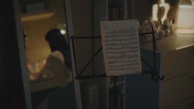 Music sheet and handwritten letter on desk