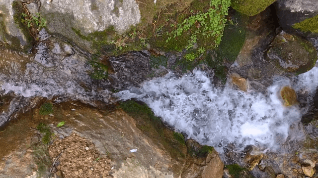 Small waterfall flowing over rocks