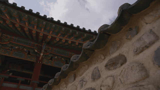 Traditional Korean houses with ornate roofs and stone walls