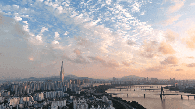 City skyline with view of river at sunset.