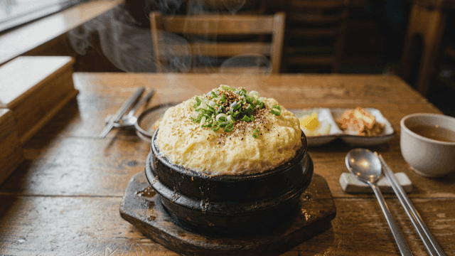 Steamed egg dish served in a hot pot