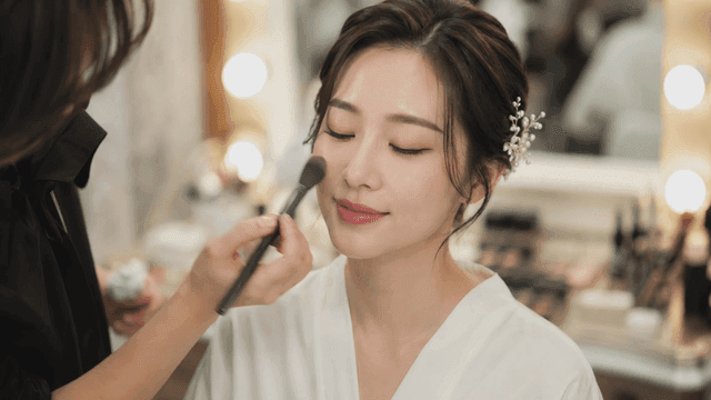 Woman getting her makeup done
