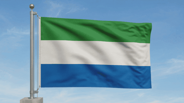 Sierra Leone flag fluttering under clear sky