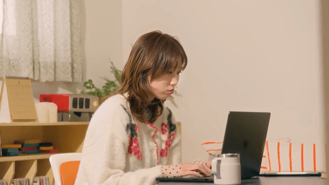 Woman working on a laptop indoors