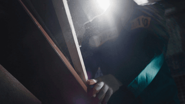 Prisoner working on large plank