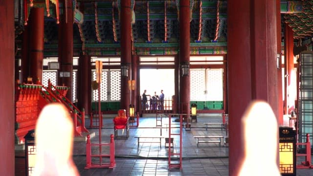 Interior of Geunjeongjeon, a traditional Korean palace with tourists, Gyeongbokgung Palace