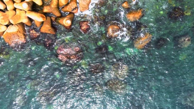 Aerial View of Coastal Rocks and Clear Waters