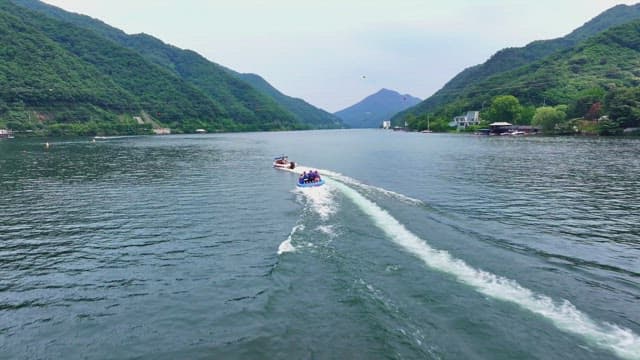 People enjoying a banana boat ride on a river