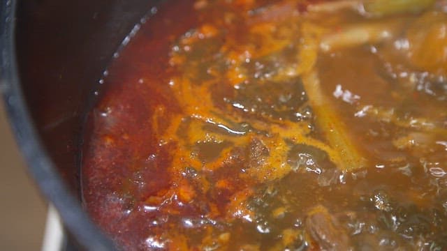 Boiling dried radish greens soybean paste soup in a pot with various ingredients