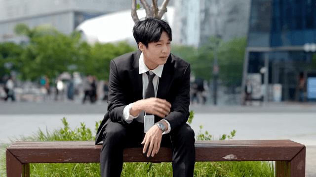 Male office worker with a clearly tired look on his face