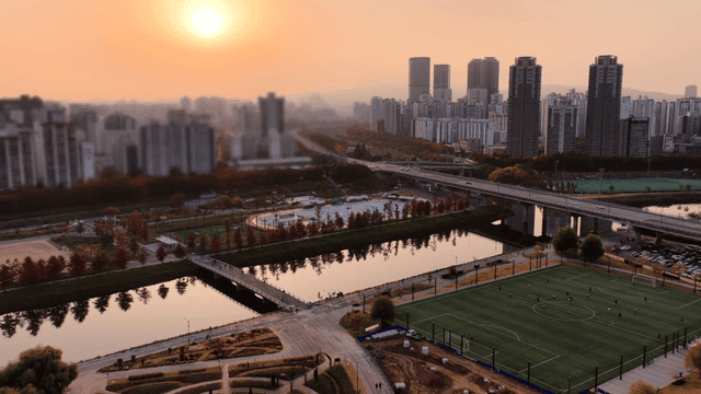 Cityscape with sunset and river view