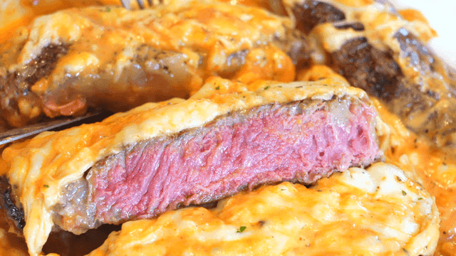 Cheesy steak with a juicy pink center