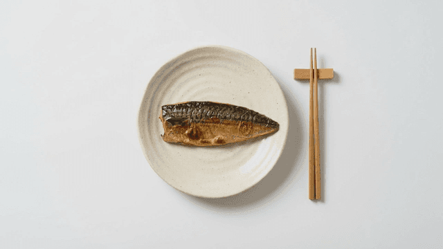 Grilled mackerel on a white plate