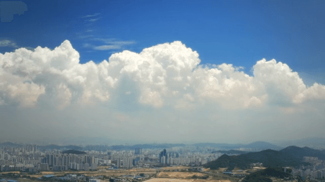 Cityscape with towering clouds