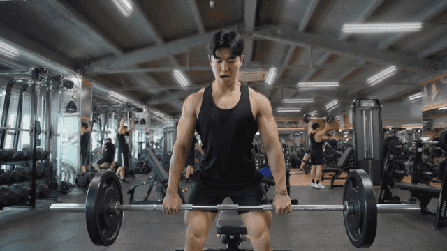 Man lifting weights in a gym