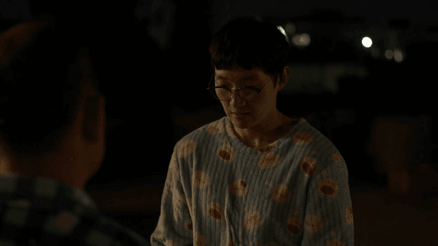 Two people having a conversation at night