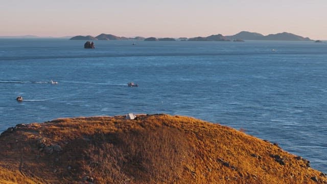 Serene Coastal Landscape with Hills and Sea