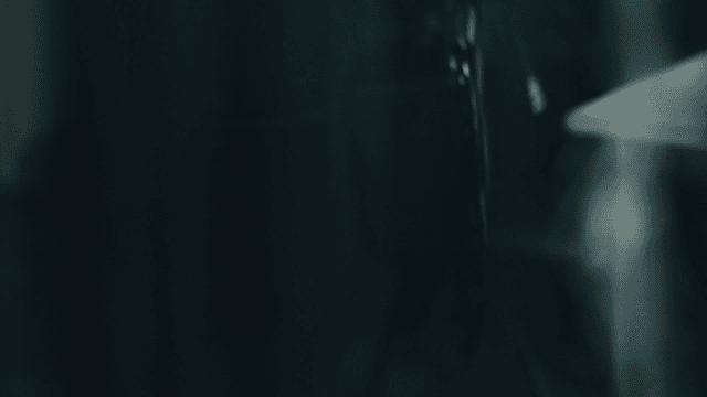 Man placing black case on table