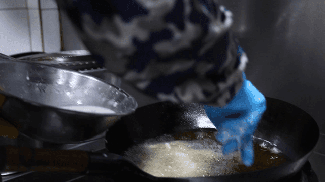 Batter being fried in kitchen