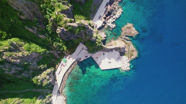 Coastal cliffs and clear blue sea