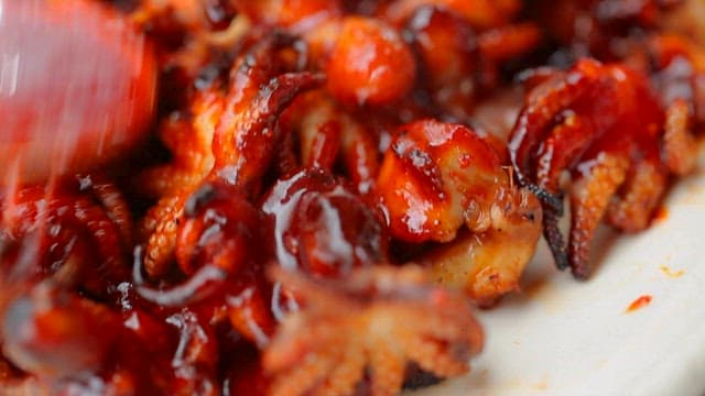 Adding Seasoning to Well-Grilled Octopus