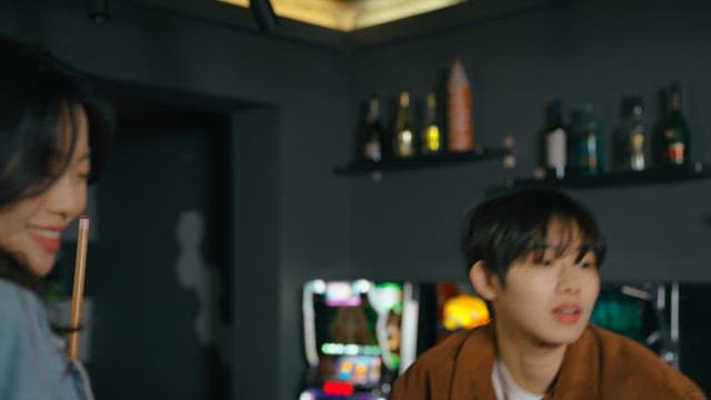 Friends Competing in a Game of Pool