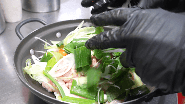 Green onions filling pot