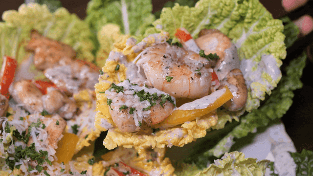 Shrimp salad with sauce on cabbage leaves