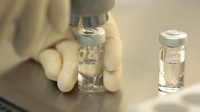 Medication Vials Being Filled in Laboratory