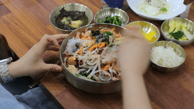 Person enjoying Cold Raw Fish Soup