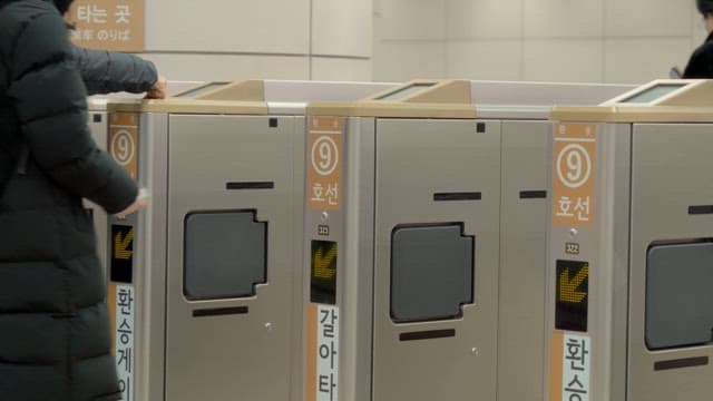 People passing through subway gates