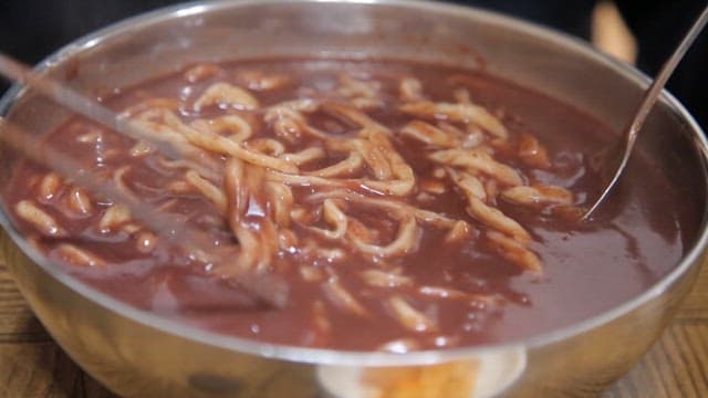 Chopstickful of thick, warm red bean noodle