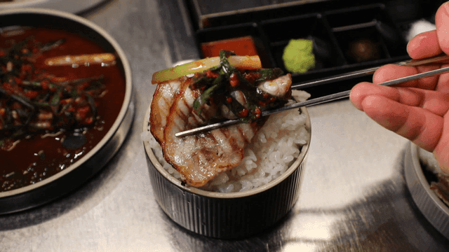 Grilled pork belly with green onion kimchi on rice