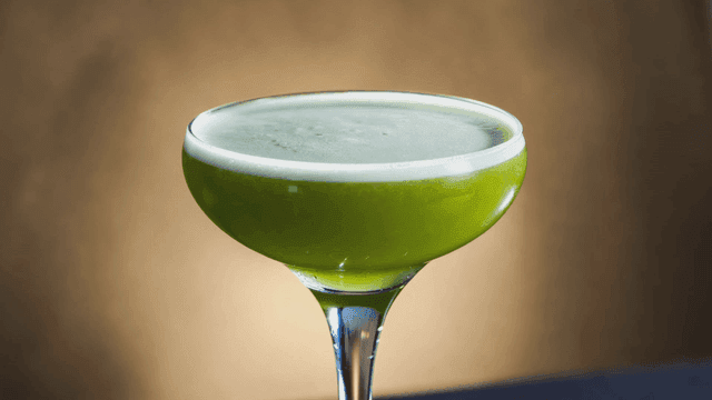 Green Midori Sour Cocktail in glass