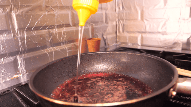 Honey poured into pan on stove