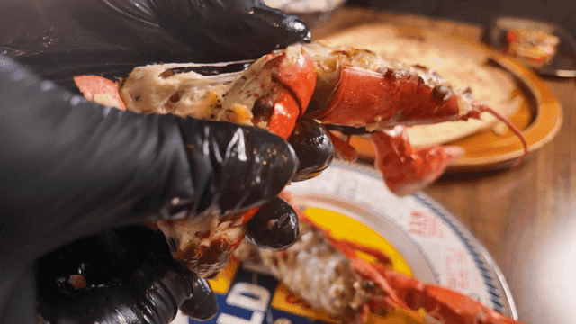 Grilled cheese lobster prepared on plate