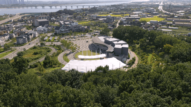 A modern cityscape with green parks
