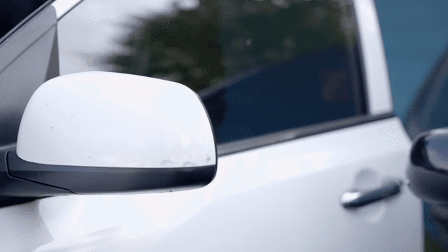 Office worker male riding in car
