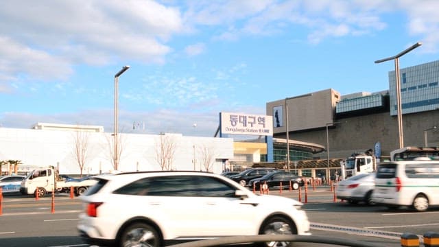 Busy Urban Traffic Scene by a Station